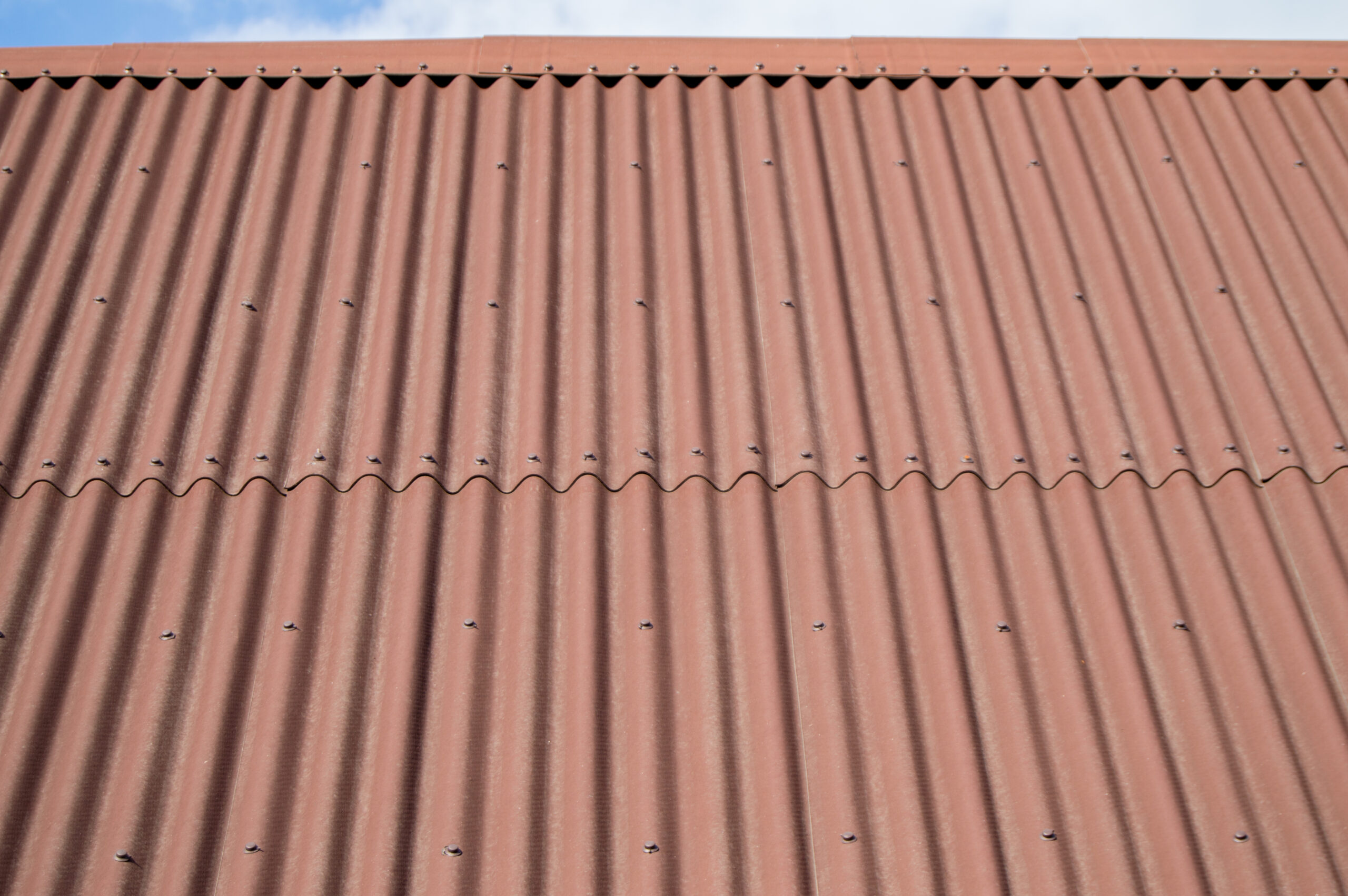 Brown wave shaped metal siding, roofing material.